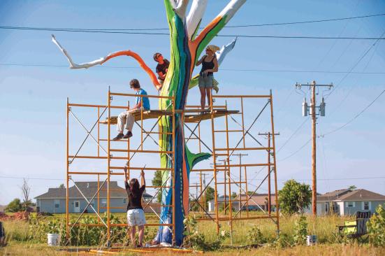 Dreams, Wings, and Beautiful Things Across a range of media, Joplin's artists have chronicled the community's rekindled hope and optimism. Above, artists paint a tornado-damaged tree in rainbow colors.