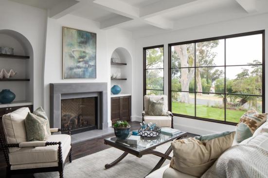 Luxurious Living Area featuring The Dylan Fireplace Surround in Aged Teak, Honed finish from Kindred Outdoors + Surrounds