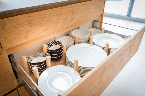 Kitchen cabinet drawers are easily customizable with pegs.