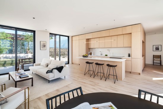 The home’s material palette is intentionally very minimal, highlighting its textured 3D-printed exterior.