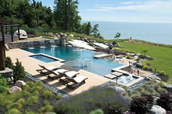 Two-Sided Story: This lake Michigan pool offers two unique and opposite views — a natural aesthetic when seen from the lake and a modern view when seen from the home.
