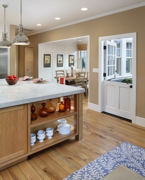 Homey interiors open to a hand-laid brick front porch.