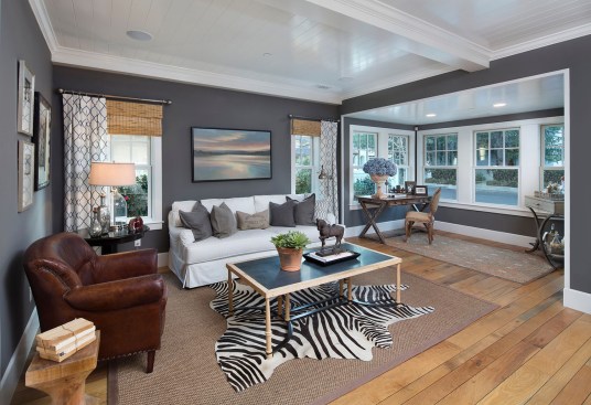 Large windows provide light-filled interiors yet maintain privacy on the tight lots. The builder avoided window-to-window positioning on adjacent homes.