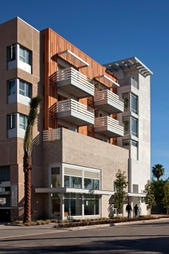 Glass corners and private balconies with wood French doors provide appealing indoor-outdoor connections.