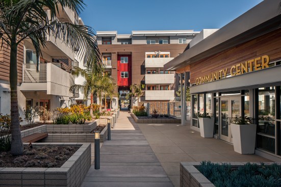 The theater is on the podium level and reads as a separate building. It offers the opportunity for local school children to perform with seniors.