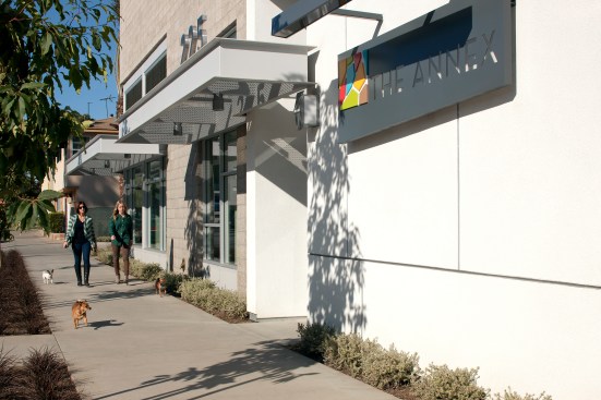 The smaller-scaled Annex building faces into a neighborhood of one- to three-story buildings and contains 39 of the 200 affordable units.