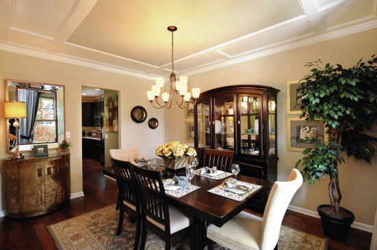 Finishes such as tray ceilings and hardwood flooring are found in some of Level Homes’ dining rooms.