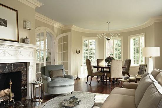 For the renovation of this 1924 villa, David Heide Design Studio redesigned the upper and lower condominiums based on the owners' preferences. A formal, traditional style with period touches reigns on the lower level. Here, the living room flows into the curved, window-lined dining area.