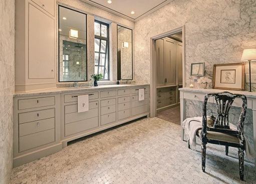 For this "marble box" bathroom design, DeRhodes Construction used honed Carrera marble throughout to lovely effect. Overhead recessed lighting by Lightolier (lightolier.com) illumates the space.