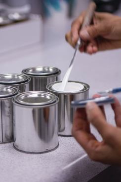 At one point during the manufacturing process, dry pigment is dispersed in water, and the particles’ “fineness of dispersion” is checked for consistency. Next, the dispersed pigment is mixed with acrylic binders (“resins”), thickeners, and additives. Before it receives final approval, technicians confirm the paint’s viscosity, tinting strength, pH, and numerous other qualities. 


