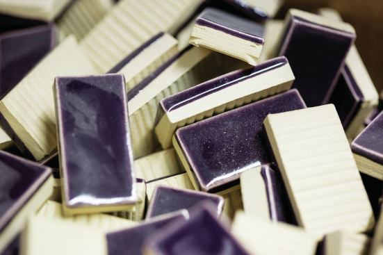 Extra tiles remain in a box at North Prairie Tileworks.