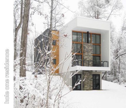 Public Voting Winners - First Place:  Hole One House, Clemmons, N.C.  Designer: Adam Sebastian  Builders: Ken McDaniel & Adam Sebastian  Designer’s description:  Located in the Yadkin River Valley near Clemmons, N.C., Hole One House features a passive solar design and is just 20 feet wide by 67 feet long.  Designed to be as hyper-efficient as the budget would allow—$85 per square foot—the home features 2x6 and 2x8 wall construction, precast concrete basement/foundation walls, and spray foam insulation, in addition to highly efficient windows, appliances, and mechanical systems. The strong backward C-shaped form that the front of the home projects is intentional and serves several functions: to mitigate the summer sun (roof), to shield the arrant golf ball from hitting south-facing windows (wall), and to create a cantilevered balcony on the exterior (floor).