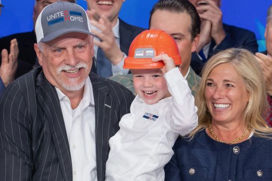 Michael and Robyn Nieri with their grandson, West, at the Nasdaq bell ringing.