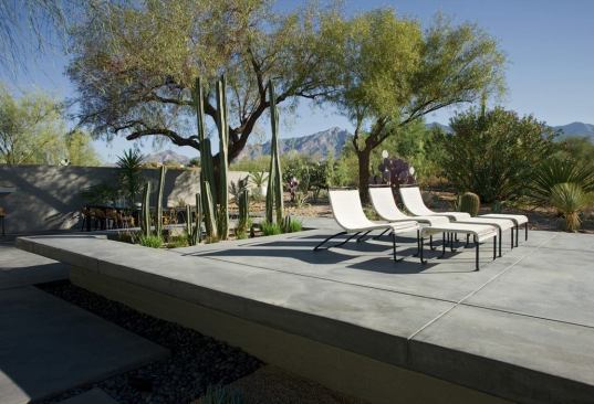Ibarra and Rosano used elevated concrete planes to highlight special areas for 'socializing and contemplating.' The goal, they say, was to give the homeowners and their guests the sensation of 'sailing into the horizon on a stationary lawn chair.'