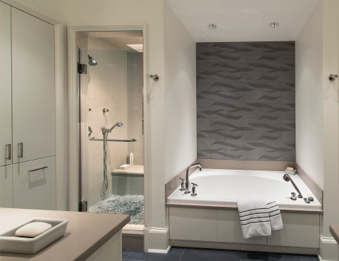 Light tones are paired with a patterned backsplash for a sophisticated color scheme. Project: A Move to the City by Muse Architects 