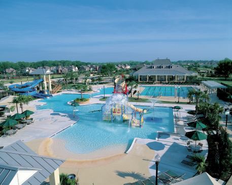 Sienna Plantation's Waterpark is designed for all ages and includes slides, play features, and zero entry areas for lounging 

in the water.