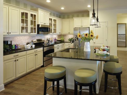 The kitchen is a focal point in the Clear Day model, located in River’s Reach in Parrish, Fla. The two-story home provides a through-view from the front of the house to the outdoor living area in back.