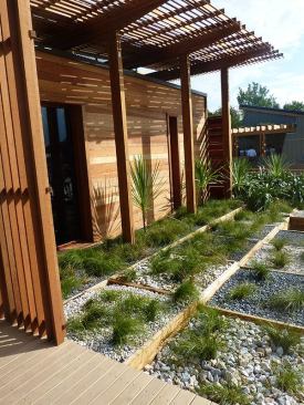 Plantings relate to the various ecosystems native to New Zealand including dune grasses, coastal shrubs, forest edge, alpine zone, and backyard gardens.