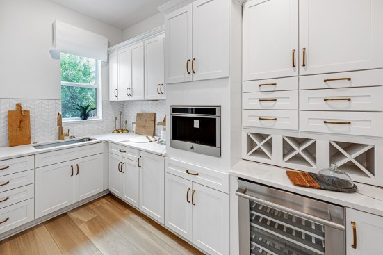 With the prep kitchen taking care of the more functional cooking requirements, the main kitchen can focus on aesthetics.