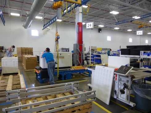 After the unit goes through the hot test cell for performance and safety standards, quality assurance officers check all components as it comes off the assembly line.
