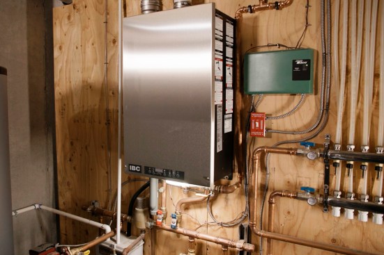 Because it uses radiant heating fed by a condensing propane boiler — which uses minimal electricity — the Boyd residence can use a smaller, more affordable standby generator.