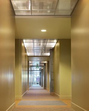 Paying homage to the neighborhood’s industrial heritage, interior corridors in this Emeryville, Calif., apartment building are outfitted with ceilings of t-bar and polycarbonate panels. Lights are mounted above the translucent panels, allowing the plumbing and mechanical systems to remain subtly visible. Architect: Kwan Henmi Architects/Planners, San Francisco Builder: Barry Swenson Builders, San Jose, Calif.