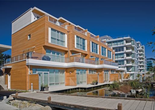 Dockside Green residents enjoy views of the central green space, which is landscaped with native plants.