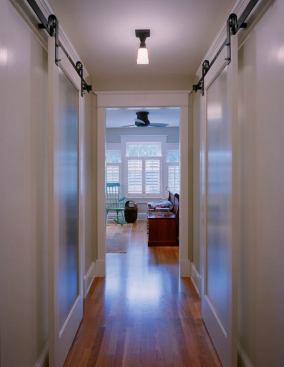 Built in 1919, this Craftsman bungalow had already survived a few changes when its new owners decided to give it a face-lift. Dedicated to restoring the home’s original 1920s character while allowing the space to meet the needs of a 21st-century family, Moore Architects employed sliding doors that leave hallway space uninterrupted. Beautifully detailed hardware stays true to the home’s original character as well as the careful attention that is a hallmark of the Craftsman style.