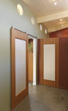 This earth-inspired entry provides access to nature in more ways than one. The bamboo door's frosted cutaway allows natural light to flow into the home, remodeled by Klopf Architecture and Marin Restoration. Meanwhile, simple hardware keeps lines clean.