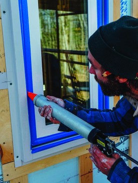 Kelly caulked the window joints.