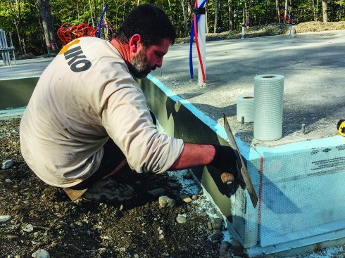 The conventional slab edge detail received an economical stucco finish.