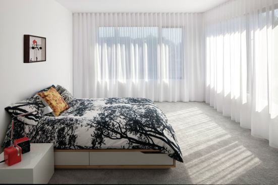 Large windows flood the master suite with light.