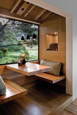 The space has all the hallmarks of a typical breakfast nook—built-in seating, table—but the architects gave it a floating cedar bench and tabletop. A downlit wall niche forms a cedar-lined display shelf.   
residential architect, September-October 2008  Sea Ranch Residence, The Sea Ranch, Calif. Turnbull Griffin Haesloop Architects, San Francisco