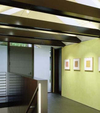 The stair down to the lower level was also reorganized so that skyline views could be seen from the front door.