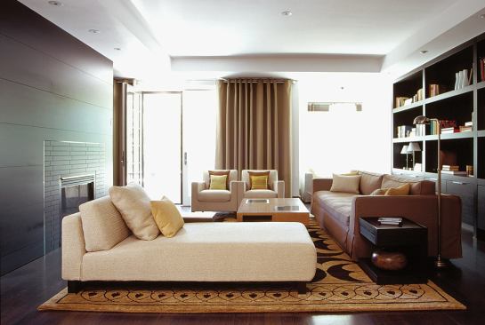 In custom residential interiors such as this Brookline, Mass., home, Hacin defines spaces with planes, materials, and light instead of full-scale walls.