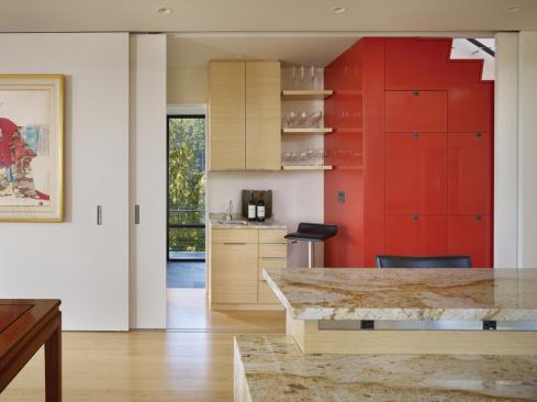 The stair compartment also holds a small bar area and access to the family room.