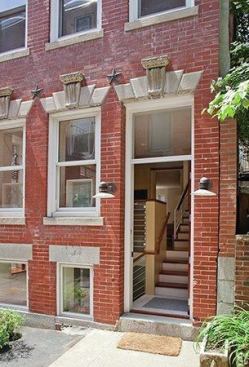 The renovated entry to this circa 1815 townhouse located in Boston’s North End neighborhood sports new windows as well as an open stairwell. Light now floods into the once windowless basement. Architect Treffle LaFleche of LDa Archtiecture & Interiors designed the space to keep the raised main floor but provide elegant access to a usable basement with a mudroom and playroom.