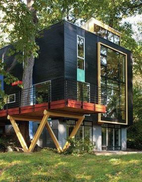 Set on a slight hill, the one-story house with a walk-out basement was transformed into a two-story house with a walk-out lower level, featuring a redesigned deck that extends off the side.
