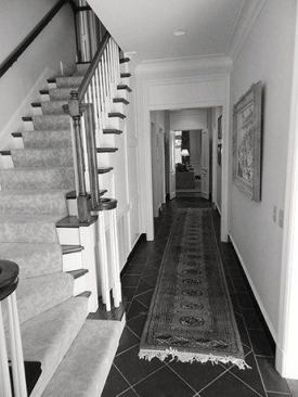 BEFORE: Wide cased doorways lining the hallway made it dark and uninviting.                             