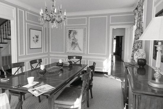 BEFORE: The existing panel molding on the dining room walls dated the room.                               