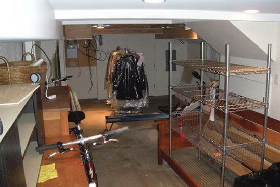 The existing basement was accessible from stairs in the center of the townhouse. The ceiling height was just 6 feet 8 inches. F.H. Perry Builder dug out the floor to add height.                             