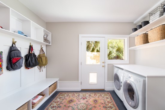 Laundry rooms like this one designed by Renaissance Remodeling factor in the entire family, including Rover.
