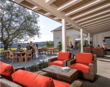 The Canyon House gathering spot features a covered open air great room, a spacious courtyard with fireplace, event lawn, and coffeehouse.