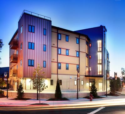 Curtain walls on the stair towers offer residents views of the Mystic River and Boston skyline. The building also has a slow-rise elevator that uses no oil, and 95% of its components are recyclable.