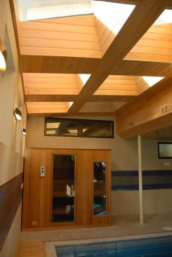 An indoor sauna provides heat retention storage for excess heat from the geothermal HVAC system.