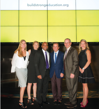 Pat Hamill, Amy Schwartz (second from left), and other team members celebrate the launch of BuildStrong Education.