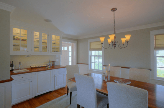 Accent. Lighted glass-front cabinets show off glassware. Glass shelving allows the light to shine through to the lowest shelf.