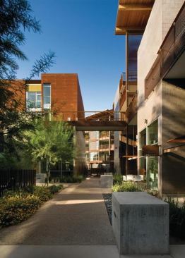 Public spaces are the organizing framework for this 4.78-acre village, which layers upscale townhomes, flats, live/work units, and retail in a neighborly setting that was formerly occupied by a hotel. The approach, which some might classify as “urban light,” accommodates 96 residential units, but maintains a comfortable scale with intertwining pathways lined with rock gardens and native plantings at eye level. Certified by Scottsdale’s green building program for multifamily dwellings, Safari Drive makes judicious use of deep overhangs, thermal mass construction, tight building envelopes, a neighborhood-wide hydronic loop heating and cooling system, and naturally weathering materials such as oxidized Cor-Ten steel and concrete block. 
Project: Safari Drive, Scottsdale, Ariz. 
Architect: The Miller|Hull Partnership 
Builder: Okland Construction 
Developers: Vanguard City Homes and The Wolff Co. 
Landscape architect: JJR Floor