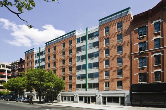 Commissioned by the Salem United Methodist City Society, Salem House is a $9.5 million, 60,000-square-foot project in central Harlem that combines affordable housing with commercial and community facilities. The building spans 130 feet in width, but doesn’t feel monolithic thanks to a segmented facade treatment that evokes the rhythm and proportions of the narrow building structures that line an adjacent boulevard. To stay on budget, the architects specified a window wall system that mimics a curtain wall, as well as a primary facade that alternates between red brick panels with punched window openings, and aluminum and glass window wall panels. 
Project: Salem House, New York, N.Y. 
Architect: RKT&B Architects 
Developer: Phipps Houses Group 
Builders: HLS Builders Corporation and Selnick/Harwood Consulting