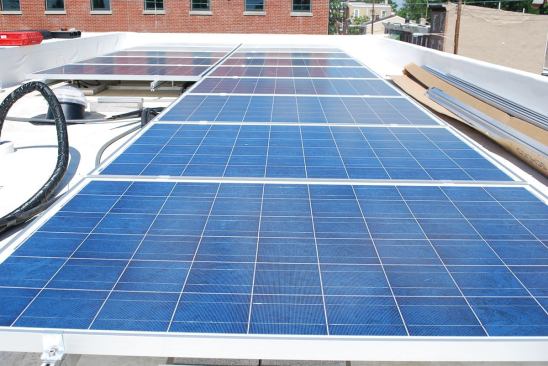 All three buyers upgraded to the 3-kW photovoltaic system, which is installed over the TPO roof on each house.